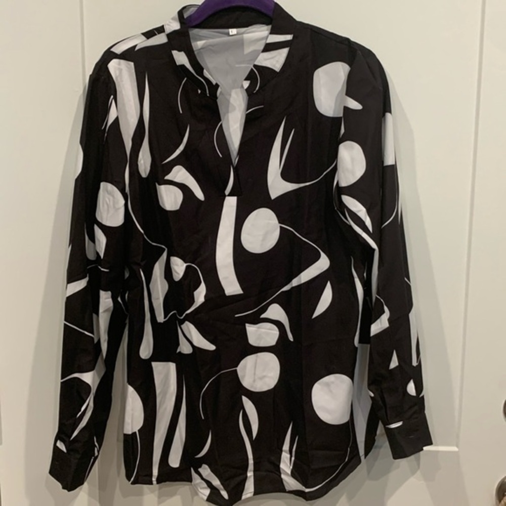 NWOT, Beautiful Black and White Geometric Design, V-neck, long button sleeves.